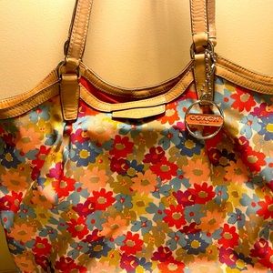 Coach purse, cloth. Multi color, floral pattern.